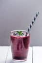 Blueberry smoothie on a wooden white background. Glass of smoothie with berry and mint. Fruit Healthy food. Breakfast. Royalty Free Stock Photo