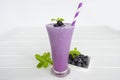 Blueberry smoothies fruit juices and blueberries on a white wooden backgroun. Drink in the morning for good health. Royalty Free Stock Photo