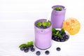 Blueberry smoothies fruit juices and blueberries on a white wooden backgroun. Drink in the morning for good health. Royalty Free Stock Photo