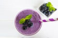 Blueberry smoothies fruit juices and blueberries on a white wooden background from top view. Drink in the morning for good health. Royalty Free Stock Photo