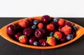 Blueberry, Strawberry and cherry faience bowl with fruit and geometric background