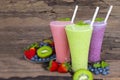 Blueberry strawberry and kiwi smoothies colorful fruit juice milkshake. Royalty Free Stock Photo