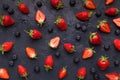 Blueberry and strawberry pattern on black background Royalty Free Stock Photo