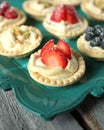 Strwberry pies on a green tray