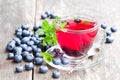 Blueberry tea with mint leaves on wooden background Royalty Free Stock Photo