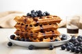 blueberry waffles topped with fresh blueberries