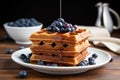 blueberry waffles topped with fresh blueberries
