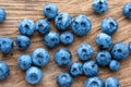 Blueberry on wooden table background. Ripe and juicy fresh picked blueberries closeup, top view Royalty Free Stock Photo