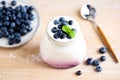 Blueberry yogurt in jar on wooden table Royalty Free Stock Photo