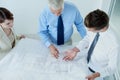 Blueprint, above or civil engineering team planning project, maintenance or renovation in meeting. Architecture, people Royalty Free Stock Photo