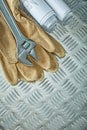 Blueprints adjustable spanner protective gloves on fluted metal