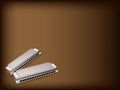 A Blues Harmonica on Dark Brown Background Royalty Free Stock Photo