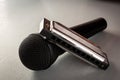 Blues harp or harmonica with microphone on grey table ,hobby or pastime