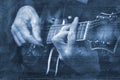 Blues music concept. guitarist playing blues. guitarist on the background of the sheet music. music sheet painted with blue waterc Royalty Free Stock Photo