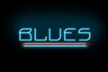 Blues. Neon inscription isolated on a black background. Music. Styles in music. Cover. Design element