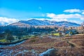 Blues skies over the Langdale Pikes. On a sunny Winter day the imposing Langdale Pikes stand proudly below a blue sky Royalty Free Stock Photo