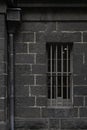 Bluestone exterior wall of the Old Melbourne Gaol or prison in Australia