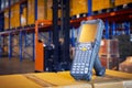 Bluetooth bar code scanner on package boxes at warehouse storage