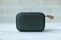 Bluetooth speaker on white wooden background. Royalty Free Stock Photo