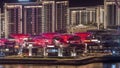 Bluewaters Island in Dubai aerial night timelapse with illuminated buildings. Royalty Free Stock Photo