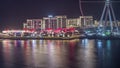 Bluewaters Island in Dubai aerial night timelapse with illuminated buildings. Royalty Free Stock Photo