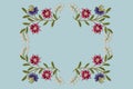 Embroidery satin stitch an square frame of branches with purple and red cornflowers and gentle white flowers on bluish background