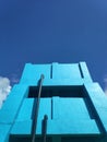 Bluish water tower under the bright blue sky