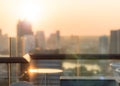 Blur abstract background city morning gold light sky rooftop view over cityscape with bright sun flare and bokeh