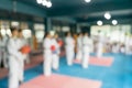 Blur abstract background of kids learning in taekwondo class