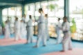 Blur abstract background of kids learning in taekwondo class