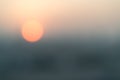 Blur abstract background of red sun going down in the city. Sunset scene or nature concept Royalty Free Stock Photo