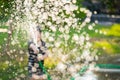 Blur of Asian child playing with water hose Royalty Free Stock Photo