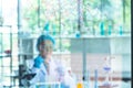Blur Asian woman scientist, researcher, technician, or student conducted chemistry research in laboratory Royalty Free Stock Photo