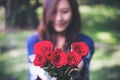 Blur Asian women giving red roses flower to her boyfriend on Valentine`s day Royalty Free Stock Photo