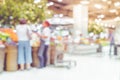 Blur background of customer shopping fresh food at Supermarket s