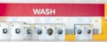 Blur background of qualified coin-operated washing machines in a public store. Royalty Free Stock Photo