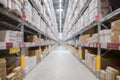 Blur background of shelves with goods boxes in modern industry warehouse store at factory warehouse storage Royalty Free Stock Photo