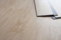 blur background. vinyl wood floor Installation for Interior design and renovate home. Home decoration with laminate vinyl wood Royalty Free Stock Photo