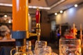blur background wallpaper closeup beer tower with bokeh at the night bar. Royalty Free Stock Photo