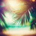 Blur beautiful nature green palm leaf on tropical beach with bokeh sun light flare wave abstract background Royalty Free Stock Photo