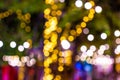 Blur - bokeh - Decorative outdoor string lights hanging on tree in the garden at night time - decorative christmas lights Royalty Free Stock Photo