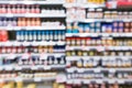 Blur of bottled food aisle selling jams and spreads in a hypermarket