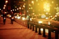 blur car on road in city with bokeh orange light at night background