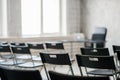 Blur Class room chair and table with white board and projector screen. white black colour concept. Royalty Free Stock Photo