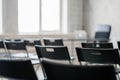 Blur Class room chair and table with white board and projector screen. white black colour concept. Royalty Free Stock Photo