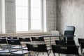 Blur Class room chair and table with white board and projector screen. white black colour concept. Royalty Free Stock Photo