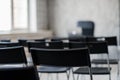 Blur Class room chair and table with white board and projector screen. white black colour concept. Royalty Free Stock Photo