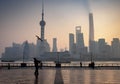 The blur effect of the man is playing the kite in this area. And Shanghai Bund historical buildings old colonial buildings,