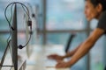 Blur focus of male technician preparing and setting equipment and tools of call center prepare and ready to use for work. Headset