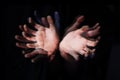 Blur, ghost hands on black background and closeup in studio on an abstract dark backdrop. Palm, fingers and